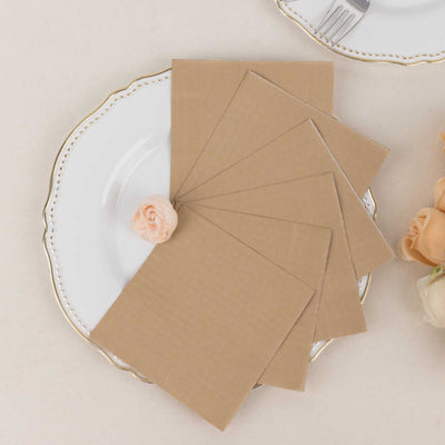 Brown cardstock sheets arranged on a decorative plate with a flower accent.