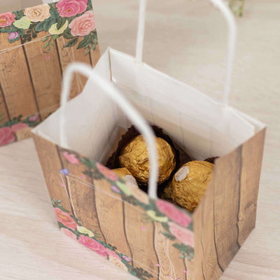Decorative gift bag with floral design containing chocolate truffles.