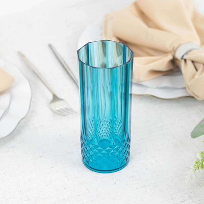 Blue decorative glass vase on a table setting.