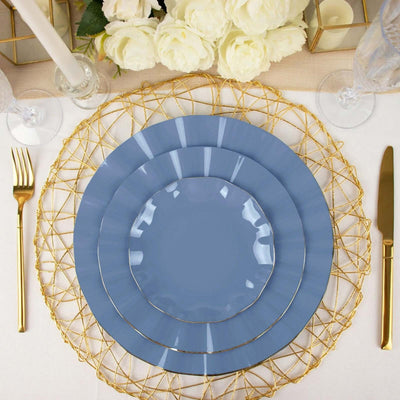 Elegant blue plates on a gold wire charger with floral centerpiece.
