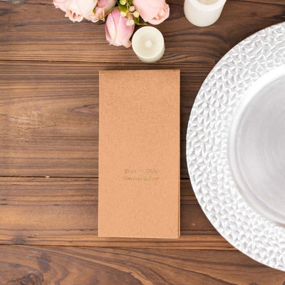 Elegant wedding menu on rustic wooden table with floral accents.