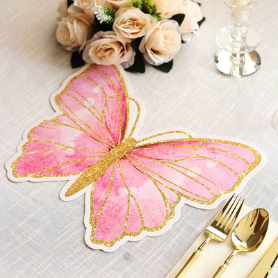 Pink butterfly table decoration with gold glitter accents.