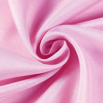 Pink fabric swirl showing soft texture and vibrant color.