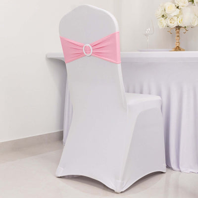 White chair cover with pink sash and decorative buckle