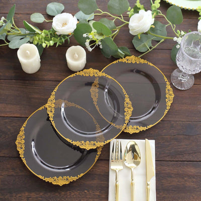 Elegant black plates with gold lace trim, styled for a chic dining setting.