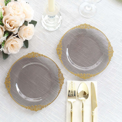 Elegant gray plates with gold trim, set for a dining experience.
