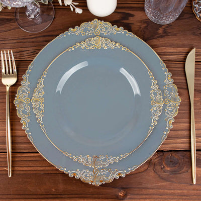 Elegant grey decorative plate with gold accents on a wooden table setting.
