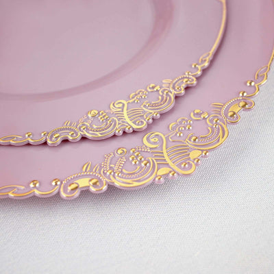 Elegant pink plates with gold ornate detailing.
