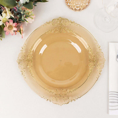 Gold decorative plate with intricate lace design on a table setting.