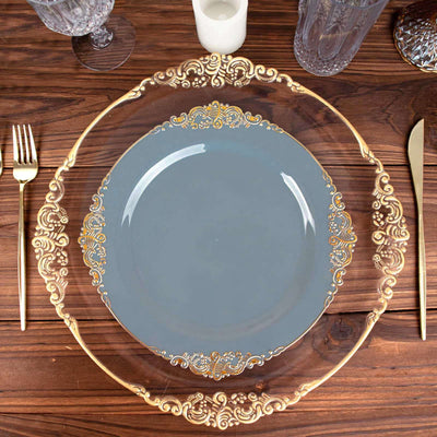Elegant gold-accented charger plate with a blue center on a wooden table.