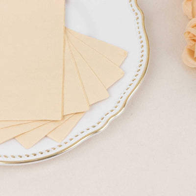 Beige paper sheets arranged on a decorative plate.