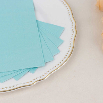 Light blue paper sheets arranged on a decorative plate.