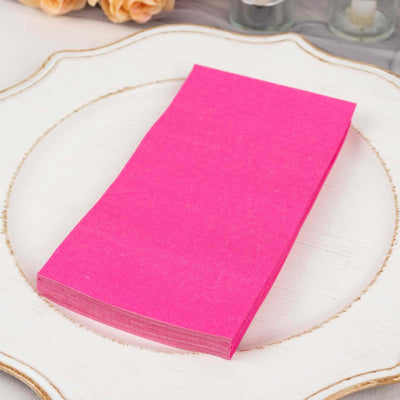 Bright pink paper sheets arranged neatly on a decorative plate.