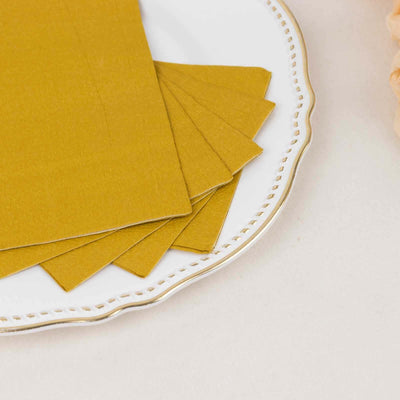 Set of mustard yellow napkins on an elegant plate.