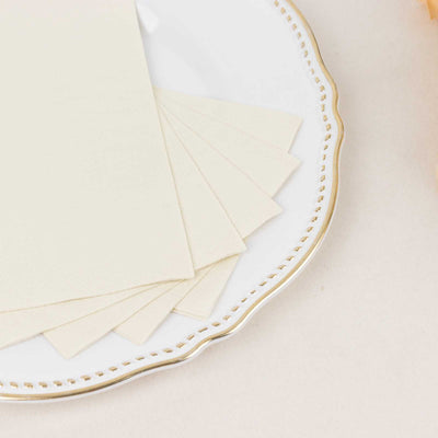Cream-colored paper sheets on a decorative plate.