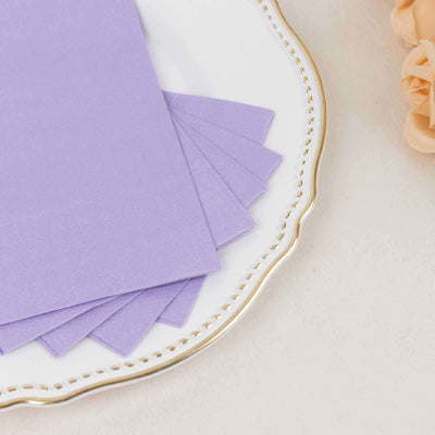 Lavender paper sheets arranged on a decorative plate.