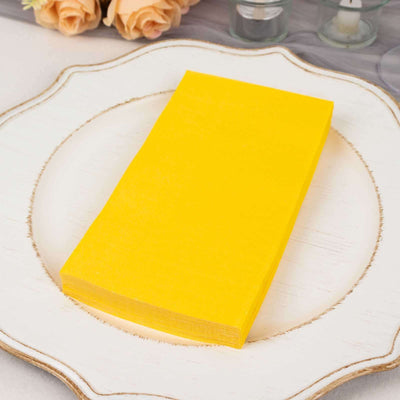 Yellow craft paper stack on a decorative plate.