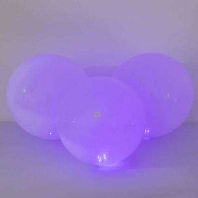 Three glowing purple balloons on a plain background.