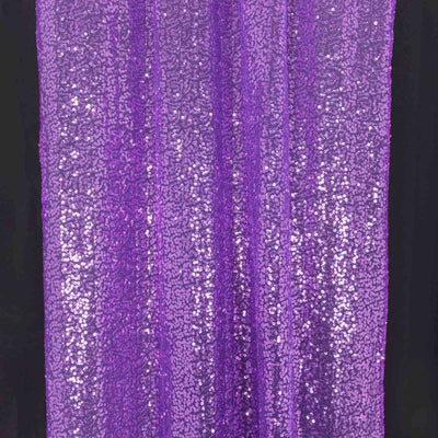 Purple sequin fabric draping with a shimmering texture.