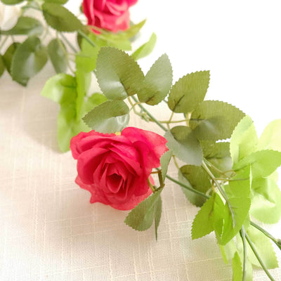 Red rose and green leaves artificial flower arrangement