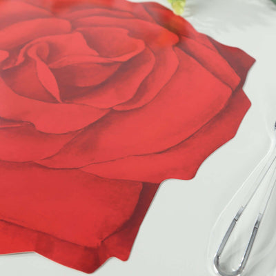 Red rose design placemat on a white surface.