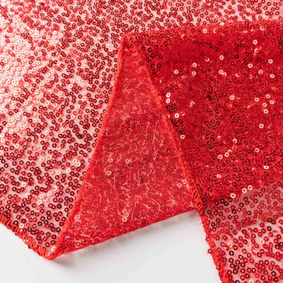 Red sequin fabric with shimmering texture and intricate detail.