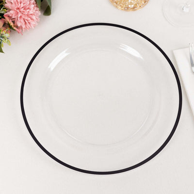 Clear glass plate with a black rim on a light surface.