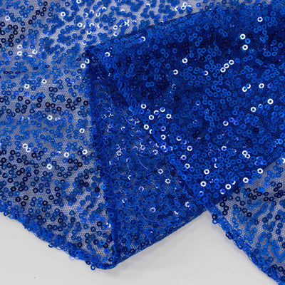 Blue sequin fabric with shimmering sequins on a sheer background.