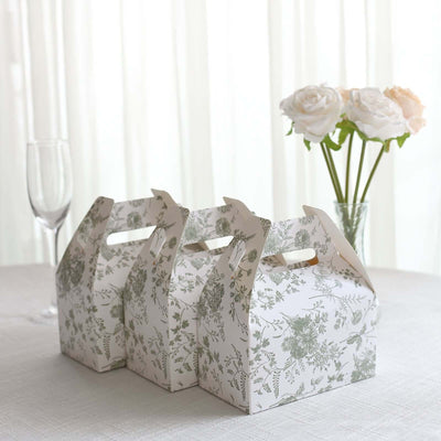 Floral-patterned takeaway boxes on a table with a vase of flowers.