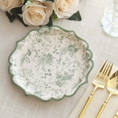 Floral-patterned decorative plate with a scalloped edge on a table setting.