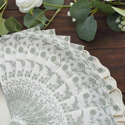 Floral patterned paper fan arranged on a rustic wooden surface.