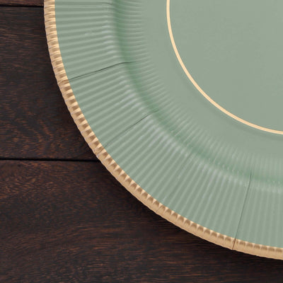 Green paper plate with gold rim on a wooden surface.