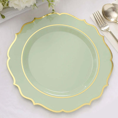 Mint green plate with gold trim on a white table setting.