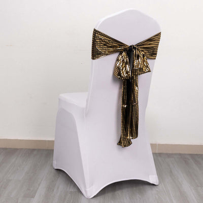 White chair cover with gold sequined bow on the back.