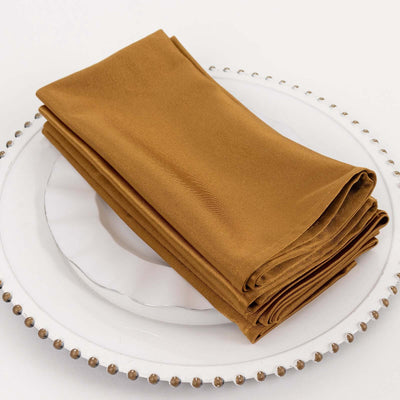 Folded brown napkins on a decorative plate