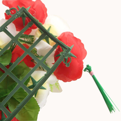 Green plastic garden trellis with decorative flowers