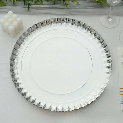 Silver decorative serving platter with scalloped edges.