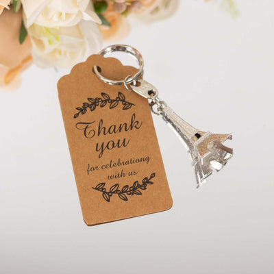 Eiffel Tower keychain with a thank you tag for celebrations.