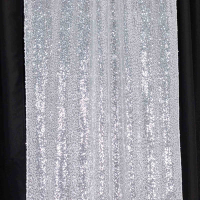 Silver sequin backdrop curtain for events and photography.