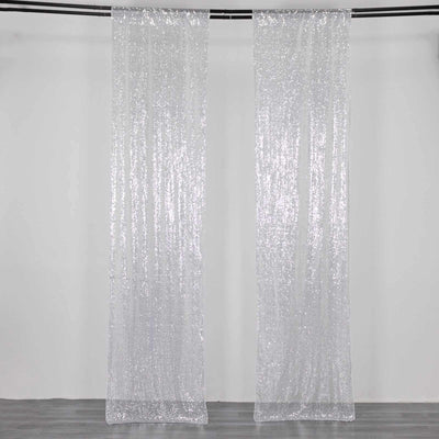 Sparkling sheer curtains hanging on a rod, adding elegance to any space.