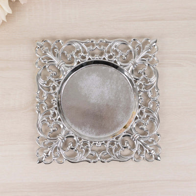 Ornate silver decorative platter with intricate design details.