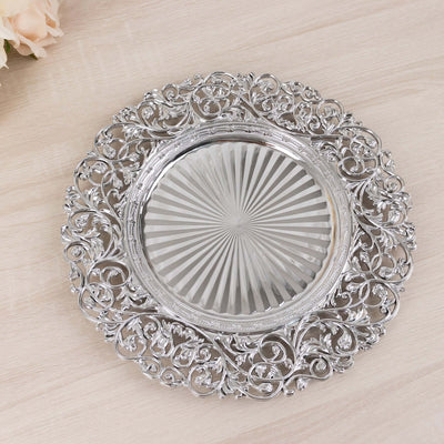 Elegant silver decorative plate with intricate floral design and ribbed glass center.