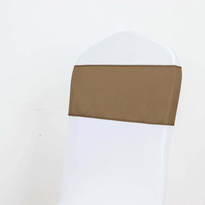 Brown chair sash on a white chair against a plain backdrop