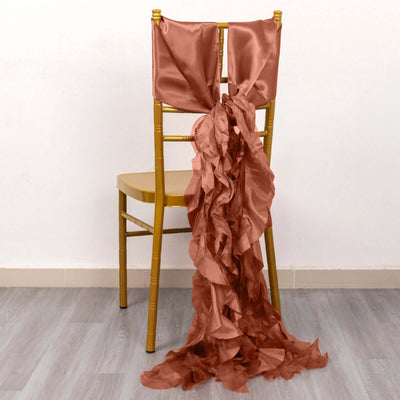 Satin chair sash with ruffles draped elegantly over a gold chair.