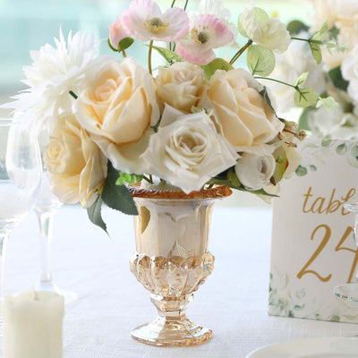 Elegant floral centerpiece in a gold-accented vase.