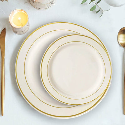 Elegant white dinner plates with gold trim in stacked arrangement.