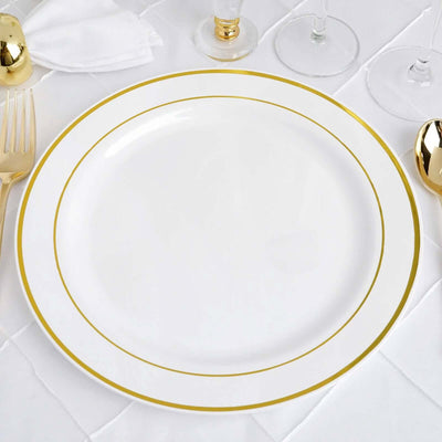 Elegant white dinner plate with gold rim on a textured table setting.