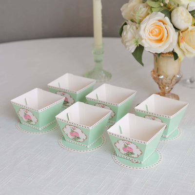 Set of six mint green floral dessert cups with matching coasters.