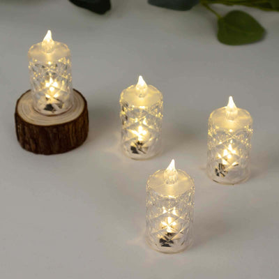 LED decorative candles in clear holders on a wooden base.