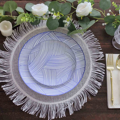 Decorative plates on a textured placemat with elegant cutlery.
